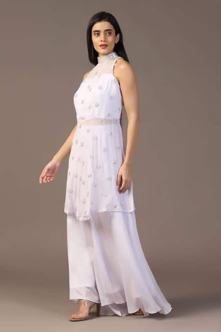 Shop Two Sisters By Gyans White Georgette Sequins, Piping Round Neck Work Peplum Top And Flared Pant Set at Aza Fashions Shop_Two Sisters By Gyans_White Georgette Sequins, Piping Round Neck Work Peplum Top And Flared Pant Set _at_Aza_Fashions