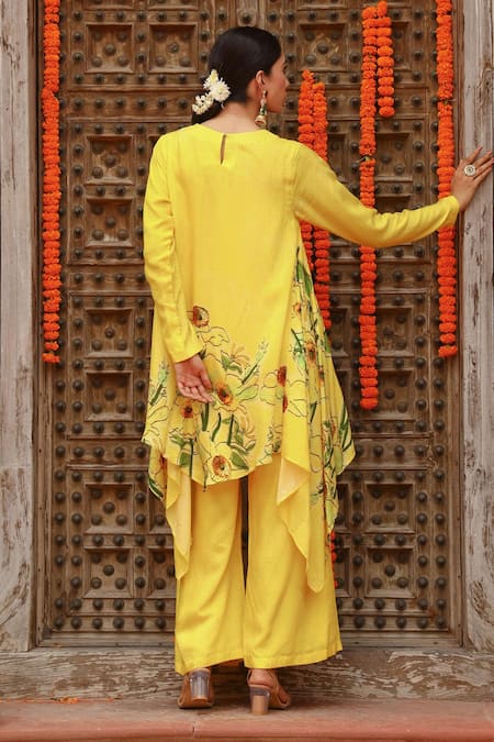 Shop Gazab by Miku Kumar Yellow Muslin Embroidery Round Neck Aria Asymmetric Kurta With Palazzo at Aza Fashions Shop_Gazab by Miku Kumar_Yellow Muslin Embroidery Round Neck Aria Asymmetric Kurta With Palazzo _at_Aza_Fashions