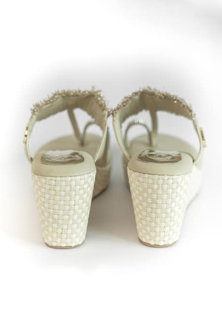 Sana K luxurious Footwear Beige Rhinestones, Fringe And Tassel Embellished Kolhapuri Wedges Online at Aza Fashions Sana K luxurious Footwear_Beige Rhinestones, Fringe And Tassel Embellished Kolhapuri Wedges _Online_at_Aza_Fashions