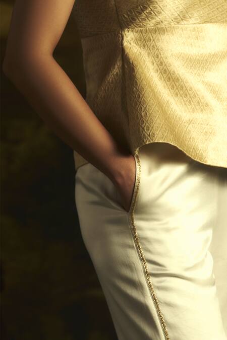 Zwaan Ivory Cotton Cut Work Hamsa Embellished Side Seam Legged Pant Online at Aza Fashions Zwaan_Ivory Cotton Cut Work Hamsa Embellished Side Seam Legged Pant _Online_at_Aza_Fashions