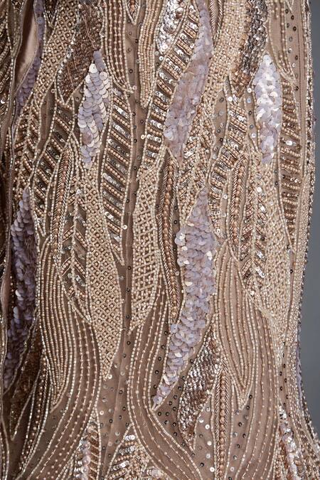 Chaashni By Maansi And Ketan_Beige Net Sequins, Beads, Cut Metallic Wave Embellished Mermaid Lehenga Set _at_Aza_Fashions