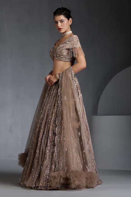Shop_Chaashni By Maansi And Ketan_Beige Net Sequins, Beads, Cut Work Metallic Wave Embellished Lehenga Set _Online_at_Aza_Fashions
