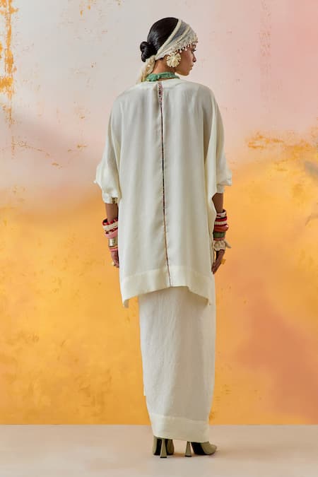 Shop Aseem Kapoor White Crepe, Silk Tassels Round Neck Trapeze Short Kurta With Draped Skirt at Aza Fashions Shop_Aseem Kapoor_White Crepe, Silk Tassels Round Neck Trapeze Short Kurta With Draped Skirt _at_Aza_Fashions
