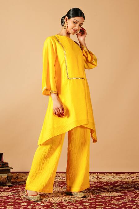 Shop Tangerine By Asfa Yellow Chanderi Silk Gota Patti Boat Neck Asymmetric Kurta With Pant at Aza Fashions Shop_Tangerine By Asfa_Yellow Chanderi Silk Gota Patti Boat Neck Asymmetric Kurta With Pant_at_Aza_Fashions