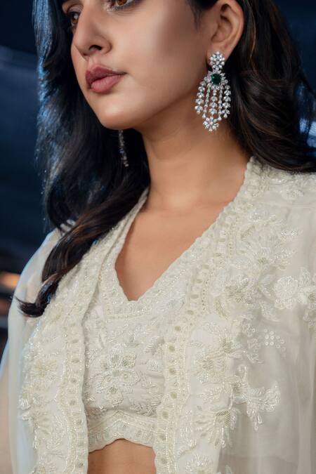 Shop Aakansha Gupta Ivory Silk Sequins V-neck Elena Tonal Thread Embroidered Cape Flared Pant Set Online at Aza Fashions Shop_Aakansha Gupta_Ivory Silk Sequins V-neck Elena Tonal Thread Embroidered Cape Flared Pant Set _Online_at_Aza_Fashions