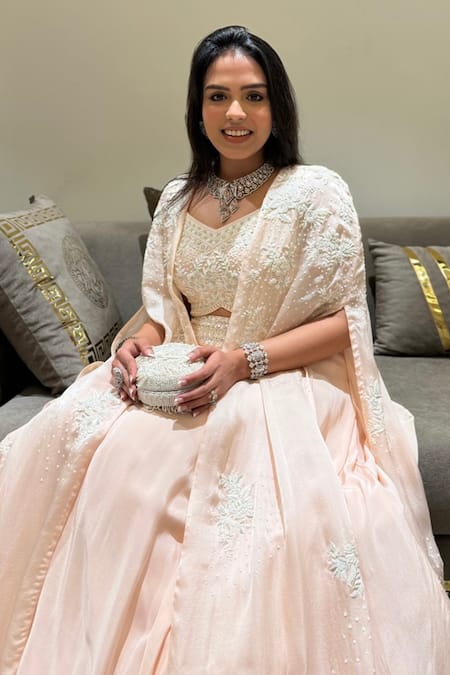 Aakansha Gupta_Peach Organza Sequins, Cut Work, Embroidery Dahlia Pastel Lehenga Cape Set _at_Aza_Fashions