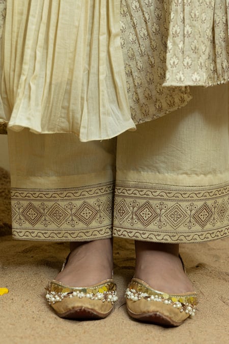 Mithi Supari_Ivory Chanderi, Cotton Tassels, Embroidery Mughal Floral Woven Anarkali Set _at_Aza_Fashions