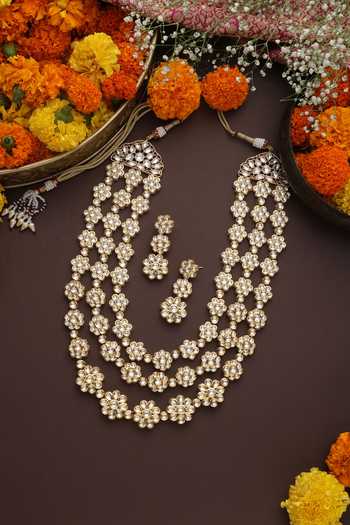 Shop Swabhimann Gold Plated Stones Floret Carved Layered Necklace Set at Aza Fashions Shop_Swabhimann_Gold Plated Stones Floret Carved Layered Necklace Set _at_Aza_Fashions