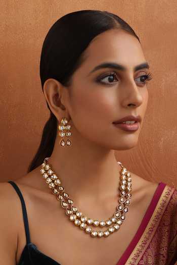 Shop Swabhimann Gold Plated Crystals, Stones Tear Drop Carved Necklace Set Online at Aza Fashions Shop_Swabhimann_Gold Plated Crystals, Stones Tear Drop Carved Necklace Set _Online_at_Aza_Fashions