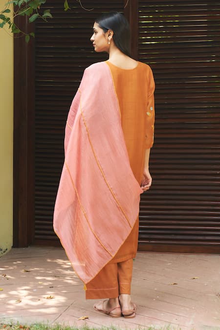 Shop Vaayu Orange Muslin, Cotton Embroidery, Tassels Round Floral Applique Kurta Pant Set at Aza Fashions Shop_Vaayu_Orange Muslin, Cotton Embroidery, Tassels Round Floral Applique Kurta Pant Set _at_Aza_Fashions