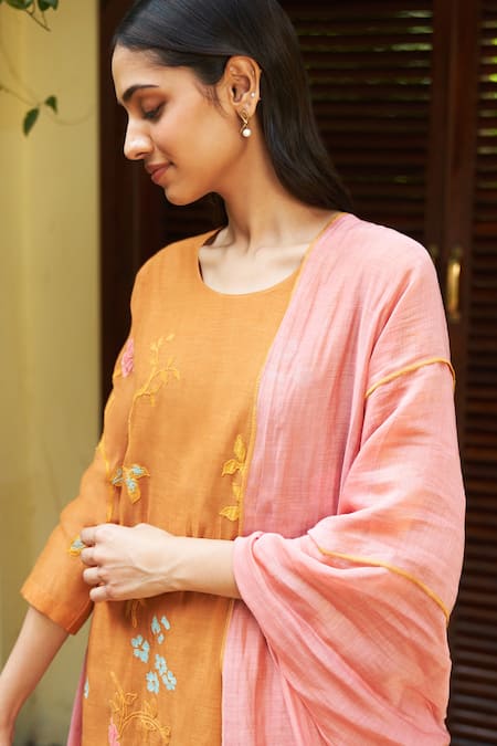 Vaayu Orange Muslin, Cotton Embroidery, Tassels Round Floral Applique Kurta Pant Set at Aza Fashions Vaayu_Orange Muslin, Cotton Embroidery, Tassels Round Floral Applique Kurta Pant Set _at_Aza_Fashions