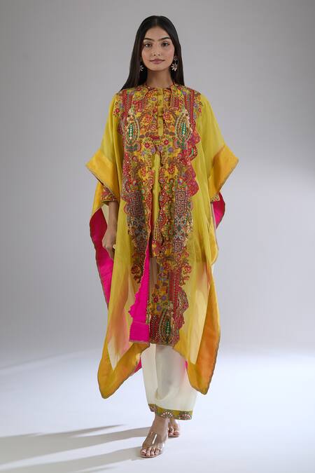 Debyani + CO_Yellow Cotton Embroidery, Mirrors Round Neck Floral Cape Pant Set_at_Aza_Fashions