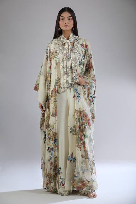Anamika Khanna Off White Cotton Embroidery, Beads, Cut Work V-neck Floral Print Cape And Pant Set at Aza Fashions Anamika Khanna_Off White Cotton Embroidery, Beads, Cut Work V-neck Floral Print Cape And Pant Set_at_Aza_Fashions