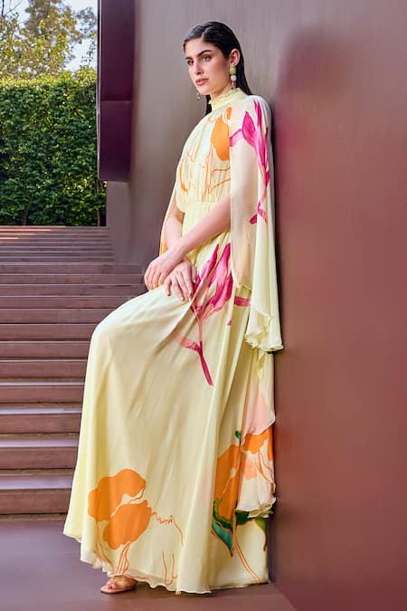 Buy Mandira Wirk Resort Beige Chiffon High Neck Botanic Flora Print Cape Sleeves Maxi Dress Online at Aza Fashions Buy_Mandira Wirk Resort_Beige Chiffon High Neck Botanic Flora Print Cape Sleeves Maxi Dress _Online_at_Aza_Fashions