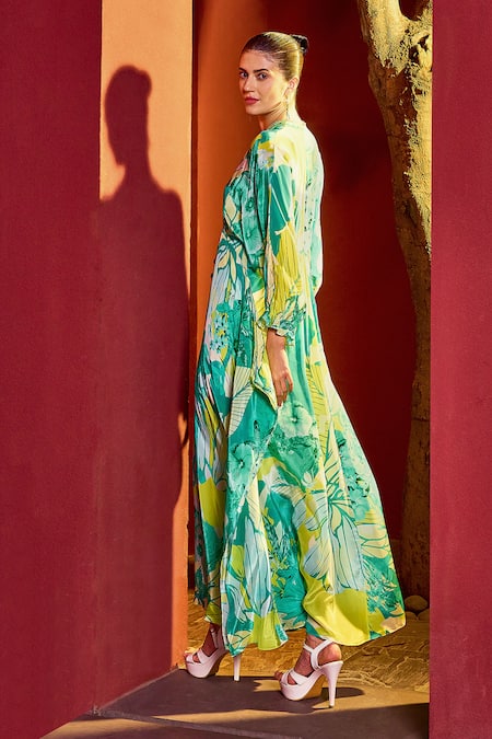Shop Mandira Wirk Resort Green Viscose, Crepe Tassels V-neck Bloom Petal Print Kaftan at Aza Fashions Shop_Mandira Wirk Resort_Green Viscose, Crepe Tassels V-neck Bloom Petal Print Kaftan _at_Aza_Fashions