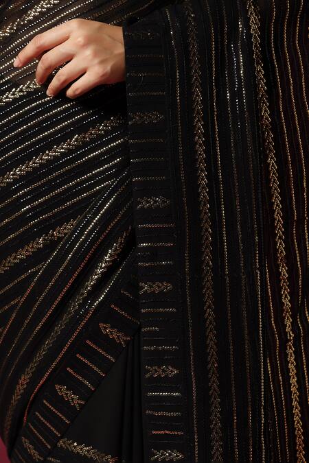 Two Sisters By Gyans Black Georgette Sequins Embroidered Saree With Unstitched Blouse Piece at Aza Fashions Two Sisters By Gyans_Black Georgette Sequins Embroidered Saree With Unstitched Blouse Piece _at_Aza_Fashions