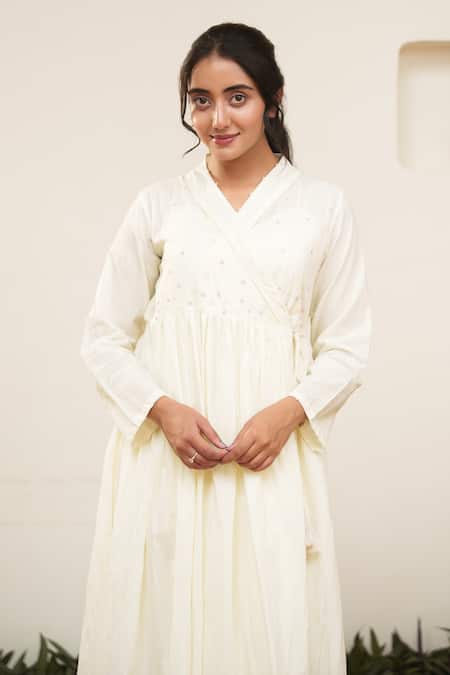 Buy OurDve Beige Cotton Pearls V-neck Embellished Wrap Midi Dress Online at Aza Fashions Buy_OurDve_Beige Cotton Pearls V-neck Embellished Wrap Midi Dress _Online_at_Aza_Fashions