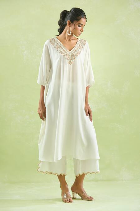 Kanika Sharma Ivory Modal Beads, Stones, Cut Work Floral Embroidered Yoke Kaftan With Palazzo at Aza Fashions Kanika Sharma_Ivory Modal Beads, Stones, Cut Work Floral Embroidered Yoke Kaftan With Palazzo _at_Aza_Fashions