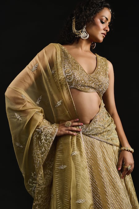 Reeti Arneja_Gold Organza, Georgette Gota Al Mallika Stripe Embellished Bridal Lehenga Set _at_Aza_Fashions