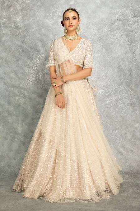 Shop_Tanu Malhotra_Ivory Net Sequins, Tassels, Embroidery V-neck Pleated Lehenga Set _Online_at_Aza_Fashions