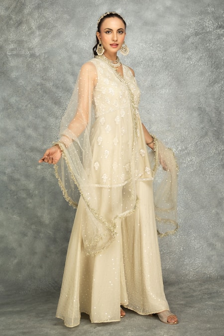 Buy_Tanu Malhotra_Ivory Net, Organza Sequins, Crystals, Floral Peplum Kurta And Sharara Set _Online_at_Aza_Fashions