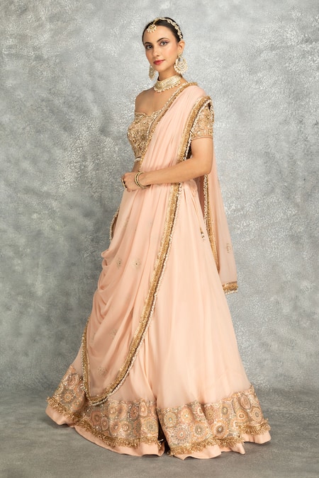 Shop_Tanu Malhotra_Peach Net, Georgette Sequins, Stones, Fringe Floral Embroidered Lehenga Set _Online_at_Aza_Fashions