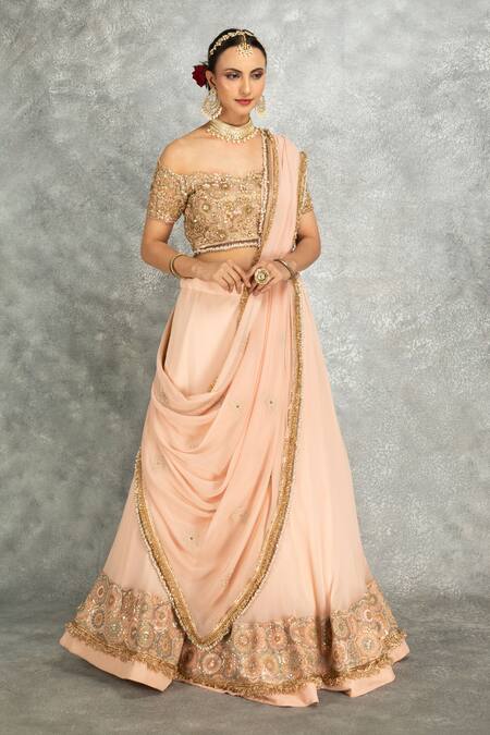 Tanu Malhotra_Peach Net, Georgette Sequins, Stones, Fringe Floral Embroidered Lehenga Set _at_Aza_Fashions