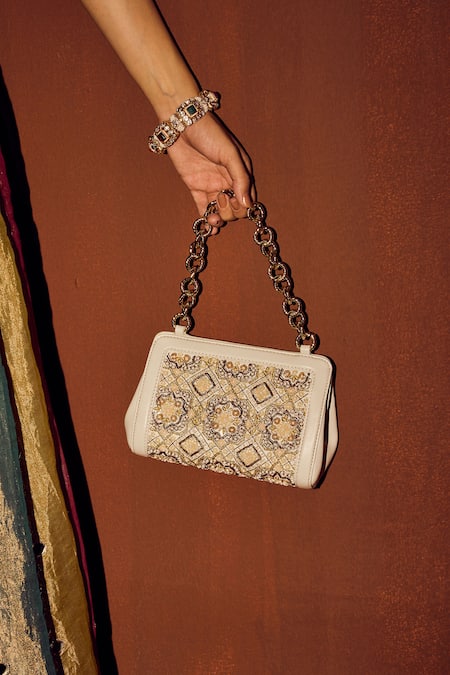 The Leather Garden Ivory Floral Embroidered Potli Bag at Aza Fashions The Leather Garden_Ivory Floral Embroidered Potli Bag _at_Aza_Fashions