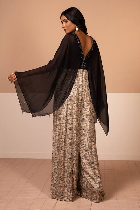 Shop Kelaayah Beige Cotton Satin Brooches, Lace V-neck Tribal Print Cape Sleeve Jumpsuit at Aza Fashions Shop_Kelaayah_Beige Cotton Satin Brooches, Lace V-neck Tribal Print Cape Sleeve Jumpsuit_at_Aza_Fashions