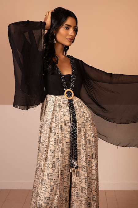 Kelaayah Beige Cotton Satin Brooches, Lace V-neck Tribal Print Cape Sleeve Jumpsuit Online at Aza Fashions Kelaayah_Beige Cotton Satin Brooches, Lace V-neck Tribal Print Cape Sleeve Jumpsuit_Online_at_Aza_Fashions