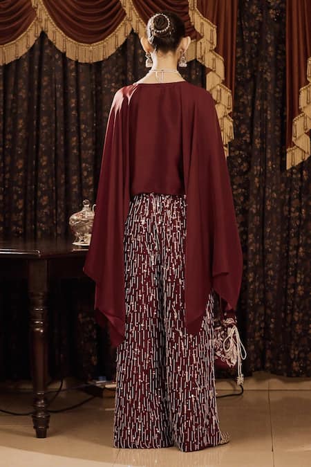 Shop Saksham & Neharicka Maroon Cotton Silk And Satin Hand Embroidery Aari V Neck Top & Palazzo Set at Aza Fashions Shop_Saksham & Neharicka_Maroon Cotton Silk And Satin Hand Embroidery Aari V Neck Top & Palazzo Set _at_Aza_Fashions