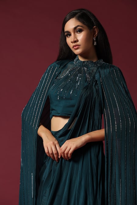 Two Sisters By Gyans Green Chiffon Sequins, Cut Work Round Neck Teal Embroidered Pre-draped Saree Set at Aza Fashions Two Sisters By Gyans_Green Chiffon Sequins, Cut Work Round Neck Teal Embroidered Pre-draped Saree Set _at_Aza_Fashions