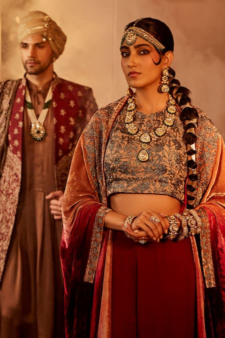 Angad Creations Maroon Silk, Velvet Embroidery, Tassels Halter Gul Border Cape And Sharara Set at Aza Fashions Angad Creations_Maroon Silk, Velvet Embroidery, Tassels Halter Gul Border Cape And Sharara Set _at_Aza_Fashions