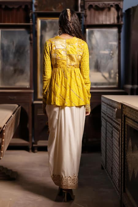 Shop Pooja-Keyur Yellow Silk Embroidery V-neck Bandhani Peplum Kurti And Pickup Dhoti Skirt at Aza Fashions Shop_Pooja-Keyur_Yellow Silk Embroidery V-neck Bandhani Peplum Kurti And Pickup Dhoti Skirt _at_Aza_Fashions