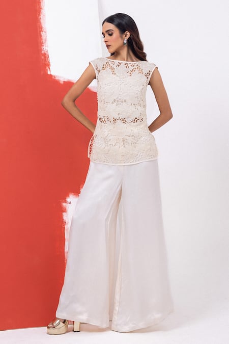 Mehak Sharma_White Satin Cut Work, Pearls Round Cutdana Embroidered Top And Flared Pant Set _Online_at_Aza_Fashions