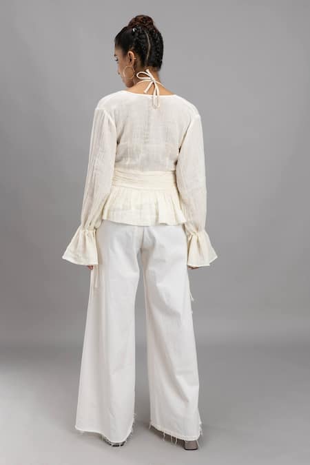 Shop Lavina Sippy White Cotton V-neck Balloon Sleeve Peplum Top at Aza Fashions Shop_Lavina Sippy_White Cotton V-neck Balloon Sleeve Peplum Top _at_Aza_Fashions