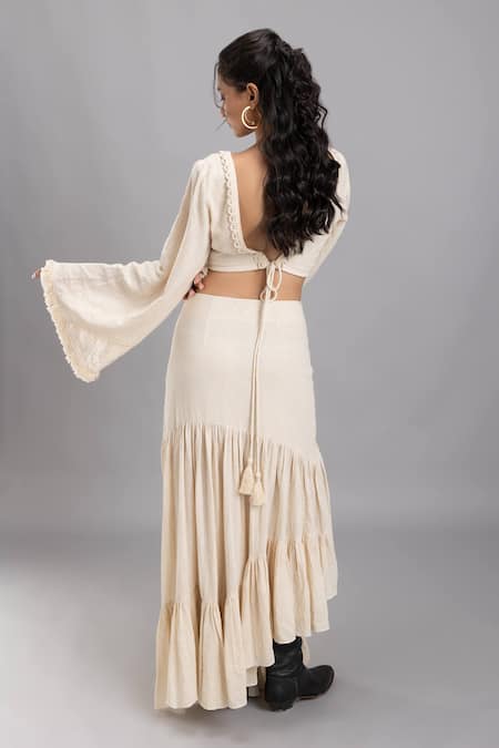 Shop Lavina Sippy Beige Handloom Cotton Lace V-neck Embellished Bell Sleeves Crop Top at Aza Fashions Shop_Lavina Sippy_Beige Handloom Cotton Lace V-neck Embellished Bell Sleeves Crop Top _at_Aza_Fashions