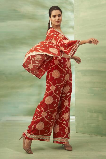Buy Seams Pret And Couture Red Crepe, Silk Embroidery, Mirrors V-neck Rooibos Printed Cape Pant Set Online at Aza Fashions Buy_Seams Pret And Couture_Red Crepe, Silk Embroidery, Mirrors V-neck Rooibos Printed Cape Pant Set _Online_at_Aza_Fashions