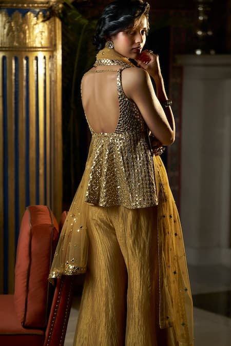 Shop Seema Gujral Gold Net, Crepe Embroidery, Mirrors Sweetheart Neck Peplum Kurta Sharara Set at Aza Fashions Shop_Seema Gujral_Gold Net, Crepe Embroidery, Mirrors Sweetheart Neck Peplum Kurta Sharara Set_at_Aza_Fashions