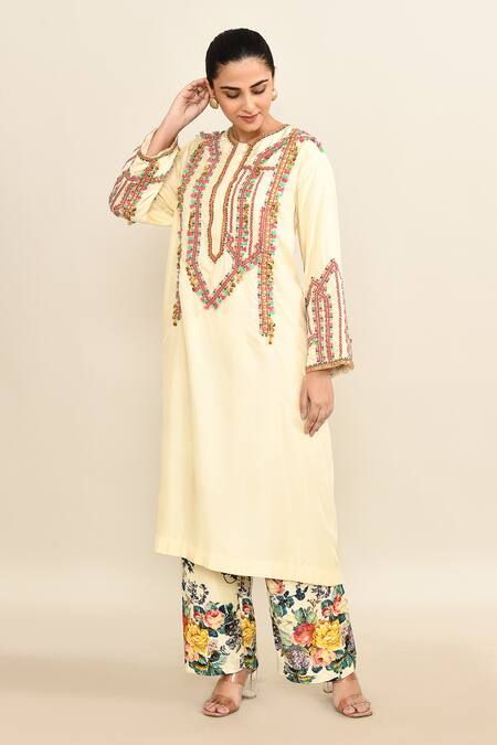 Debyani + CO_Ivory Cotton Sequins, Tassels Round Embroidered Kurta Set With Printed Pant _at_Aza_Fashions