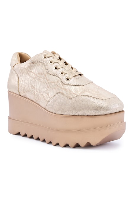 Shop Anaar Gold Groove Signature Geometric Pattern Sneaker Wedges at Aza Fashions Shop_Anaar_Gold Groove Signature Geometric Pattern Sneaker Wedges _at_Aza_Fashions