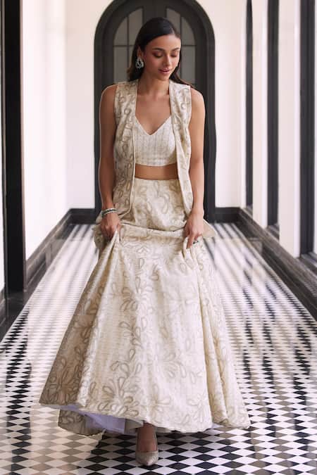 Charu And Vasundhara_Ivory Taffeta, Net, Tussar Beads, Cut Work Embroidered Waistcoat And Lehenga Set _Online_at_Aza_Fashions