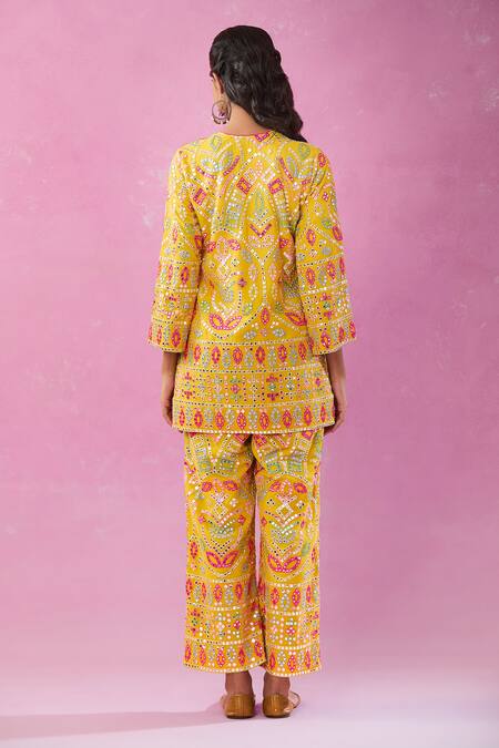 Shop Kunwarani Ritu Yellow Georgette Mirrors, Pearls, Sequins Plunge Embroidered Kurta And Pant Set at Aza Fashions Shop_Kunwarani Ritu_Yellow Georgette Mirrors, Pearls, Sequins Plunge Embroidered Kurta And Pant Set _at_Aza_Fashions