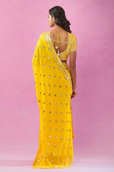 Shop Kunwarani Ritu Yellow Georgette Sequins, Mirrors Boat Neck Embroidered Saree With Blouse at Aza Fashions Shop_Kunwarani Ritu_Yellow Georgette Sequins, Mirrors Boat Neck Embroidered Saree With Blouse _at_Aza_Fashions