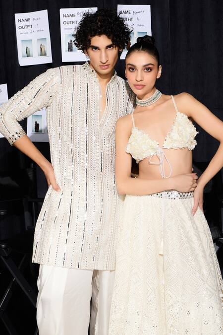 Buy Twenty Nine Ivory Net Mirrors, Lace Plunge Neck Floral Embellished Lehenga Set Online at Aza Fashions Buy_Twenty Nine_Ivory Net Mirrors, Lace Plunge Neck Floral Embellished Lehenga Set _Online_at_Aza_Fashions