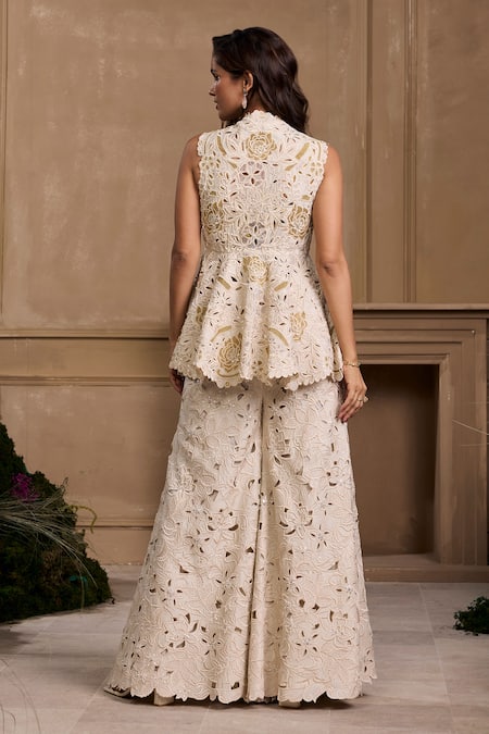 Shop Chandrima Ivory Chanderi, Cotton Embroidery, Beads Cutwork Floral Applique Peplum Jacket at Aza Fashions Shop_Chandrima_Ivory Chanderi, Cotton Embroidery, Beads Cutwork Floral Applique Peplum Jacket _at_Aza_Fashions