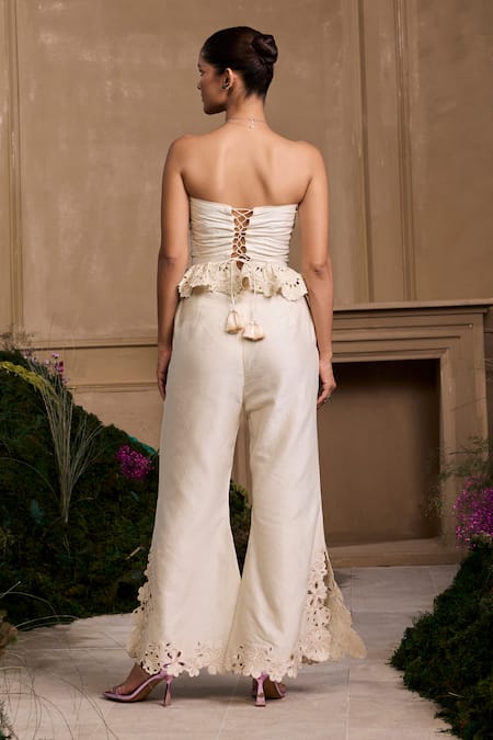 Shop Chandrima Ivory Chanderi Tassels Off-shoulder Cutwork Embroidered Smocked Bustier at Aza Fashions Shop_Chandrima_Ivory Chanderi Tassels Off-shoulder Cutwork Embroidered Smocked Bustier _at_Aza_Fashions