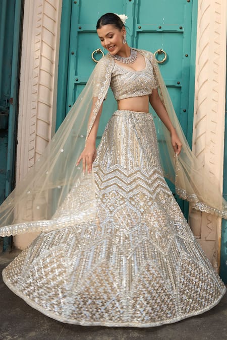 Tasuvure Indes_Ivory Net Sequins, Beads, Embroidery Scoop Neck Gold And Lehenga Set _at_Aza_Fashions
