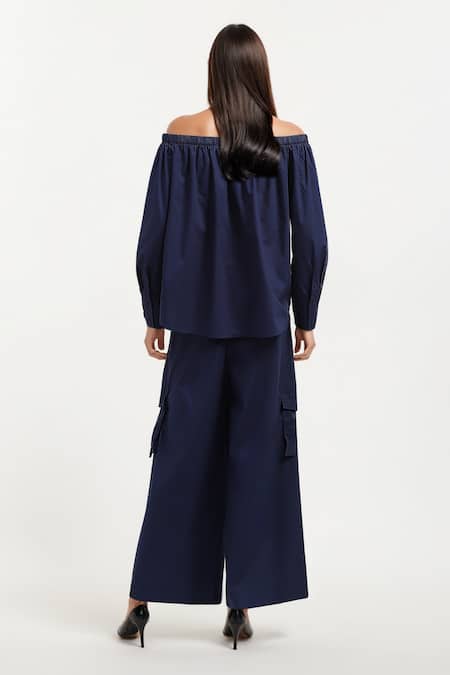 Shop AK-OK Blue Cotton Embroidery Off-shoulder Eyelet Top And Trouser Set at Aza Fashions Shop_AK-OK_Blue Cotton Embroidery Off-shoulder Eyelet Top And Trouser Set _at_Aza_Fashions