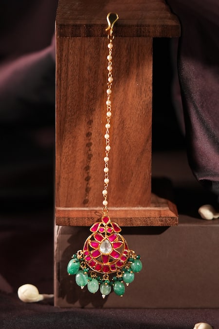 Shop Riana Jewellery Pink Floral Crescent Maangtikka With Stones at Aza Fashions Shop_Riana Jewellery_Pink Floral Crescent Maangtikka With Stones _at_Aza_Fashions